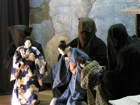 Kawano puppet show by a puppeteer on a movable chair